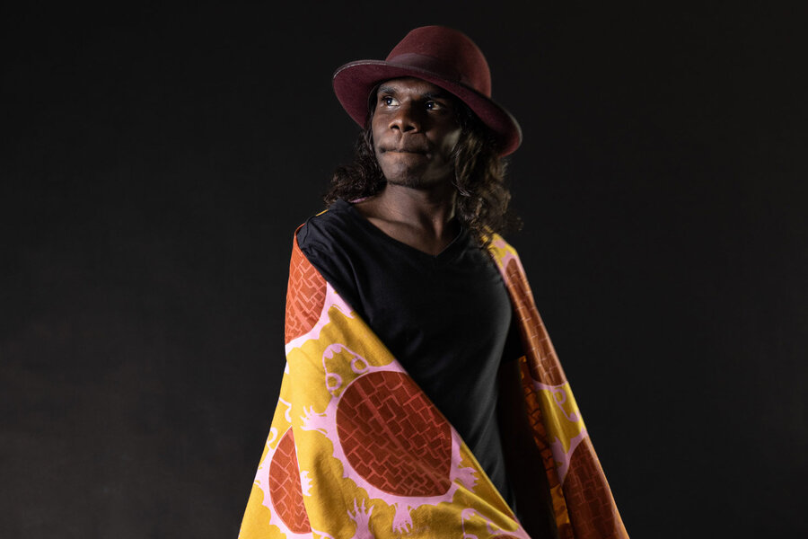 Model Enrique wears Lorna Shuan’s Freshwater Turtle design in fabric by Yalanji Arts, photo by Alison George, 2024