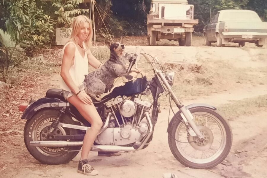 Sam, Late 1980_s. On 1970 Sportster with Aussie on the tank. Cape York adventure Landrover and HR Holden Perth back to Port Douglas car in the background.